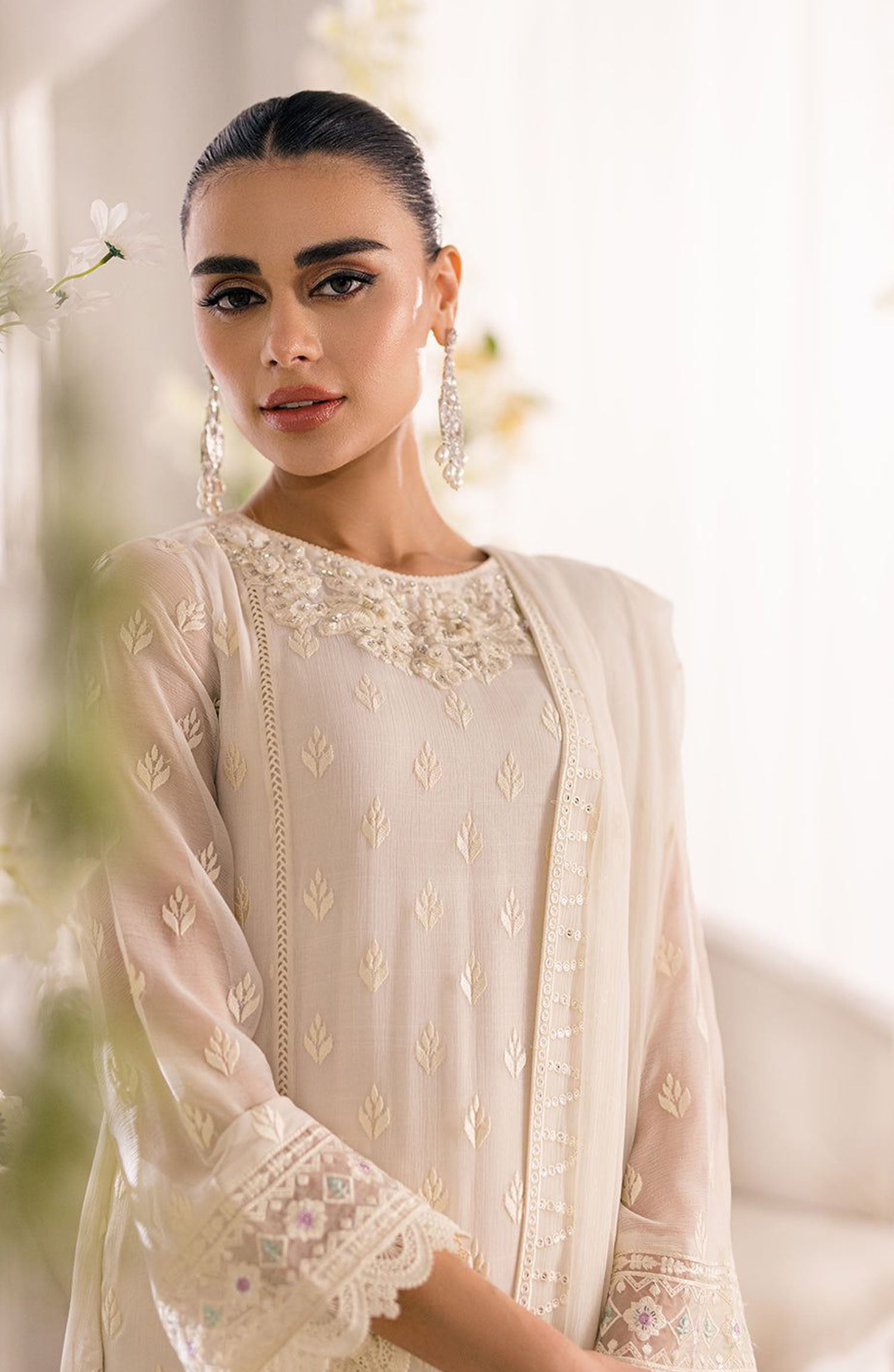 Discover the elegance of the Azure Chiffon Collection, featuring embroidered chiffon suits with a hand-embellished organza neck  embroidered patch as perfect for any special occasion, these dresses come with a stunning embroidered chiffon dupatta, a beautifully designed embroidered front daman border on embroidered organza, and a plain quality malai trouser for ultimate wear of comfort. Embrace the perfect blend of style and tradition with our chiffon embroidered dresses, crafted to add a touch of sophistic