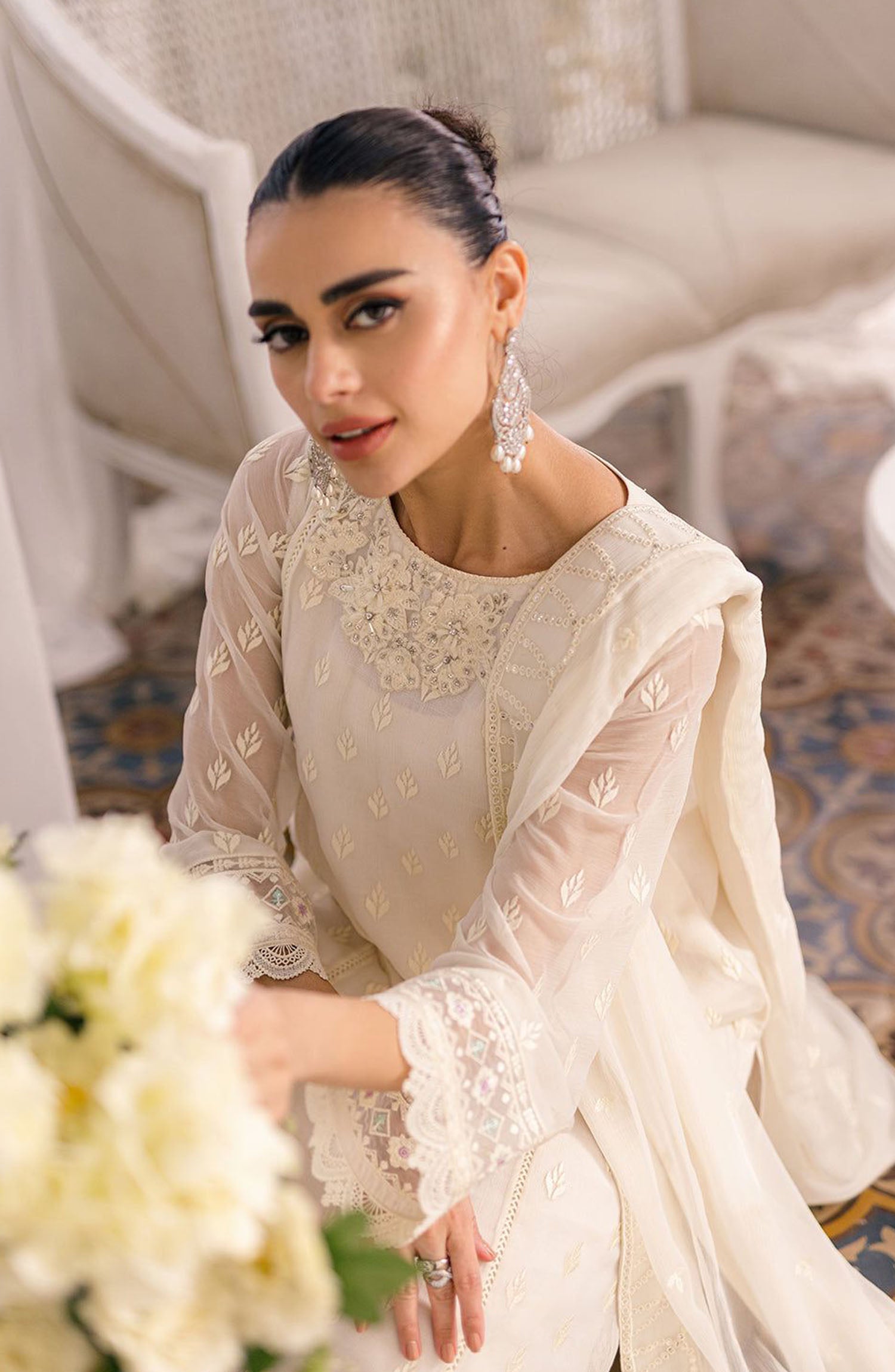 Discover the elegance of the Azure Chiffon Collection, featuring embroidered chiffon suits with a hand-embellished organza neck  embroidered patch as perfect for any special occasion, these dresses come with a stunning embroidered chiffon dupatta, a beautifully designed embroidered front daman border on embroidered organza, and a plain quality malai trouser for ultimate wear of comfort. Embrace the perfect blend of style and tradition with our chiffon embroidered dresses, crafted to add a touch of sophistic